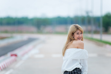 Portrait of beautiful asian woman gold hair outdoor,Happy woman concept,Lifestyle of modern girl,Thailand people