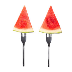 slice of watermelon on a Silver Fork isolated on white background