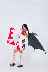Portrait of beautiful asian girl wear cosplay game animation on white background,Thailand people,Red cloths devil style