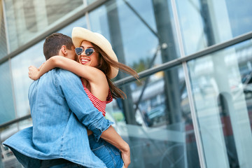 Couple Meet After Long Time. Happy People Hugging Near Airport