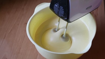 The mixer beats the eggs. Video close-up, high quality
