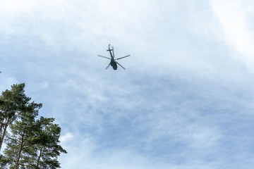 Helicopter flying, blue sky and white clouds