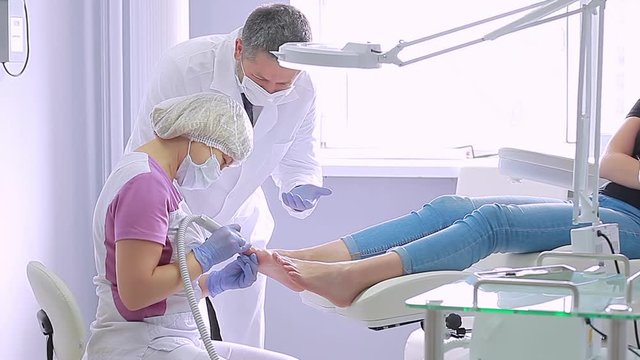 Doctor Podiatry Male and Female Counsel Procedures Health toe Nails in the Office