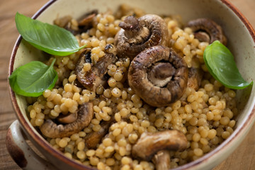 Close-up of pasta with cep boletus and champignons, selective focus, horizontal shot