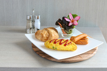 Breakfast table set selective at Croissant Bread and ice coffee ready to serve.