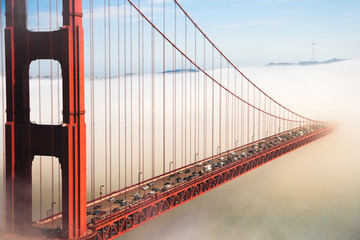 Overlook of the famous landmark the Golden Gate Bridge caught in the mist, San Francisco, California pacific coast, USA. - obrazy, fototapety, plakaty