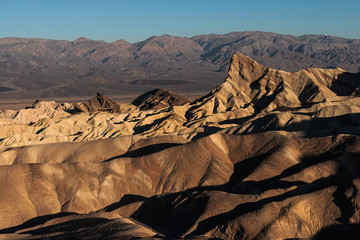 Manly Peak in Zabriskie Point on an early morning of summer, Death Valley National Park, California, USA