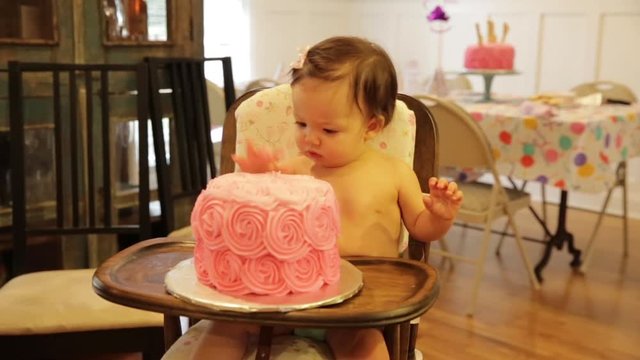 Baby Eating Smash Cake at First Birthday Party