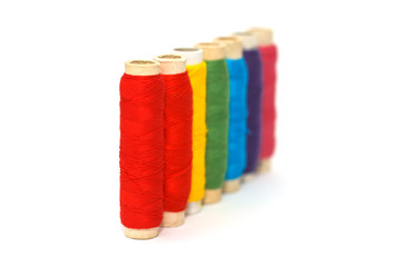 Colored thread coils from the side view on white background