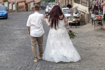 Fototapeta premium Wedding scenes with fat bride and groom at the wedding walk