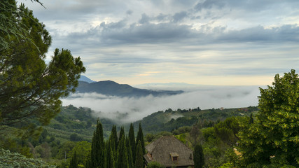 Landscape of Via Lugana, San Valentino, Rieti, Italy in the fog in the early morning - June 14, 2018