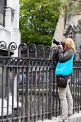 Woman Tourist with Camera in  Montmartre