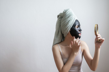 Beautiful woman with Black  facial mask, Lifestyle concept