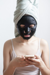Beautiful woman with Black  facial mask, Lifestyle concept