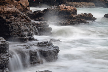 waves crashing on rocks