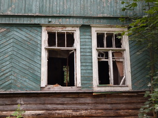 Fototapeta na wymiar Ruins of a burned wooden house