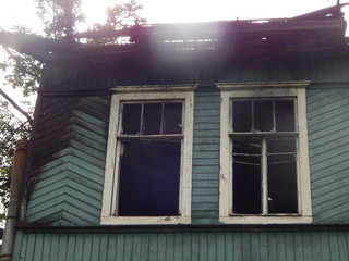 Ruins of a burned wooden house