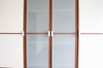 wooden white closet doors closeup for clothes modern new design