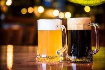 light and dark beer on a pub background.