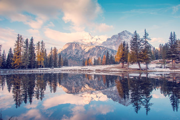 Autumn-winter landscape with lake  on Lago Antrno, Dolomites, Italy in pastel colors