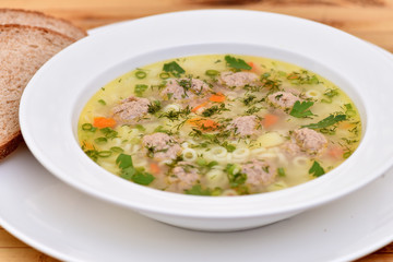 A bowl of soup on the table. Useful food.