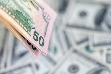 Stack of hundred dollar bills, banknotes of hundred, closeup