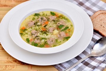 A bowl of soup on the table. Useful food.