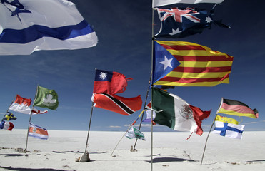 Various international flags in the middle of Salar de Uyuni, Bolivia