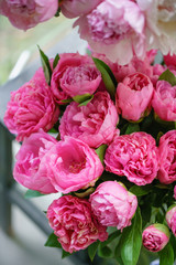 Lovely flowers in glass vase. Beautiful bouquet of pink peonies . Floral composition, scene, daylight. Wallpaper