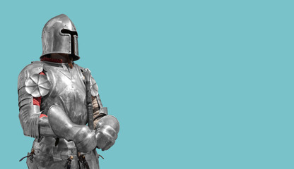 Medieval knight in shiny metal armor on a blue background.