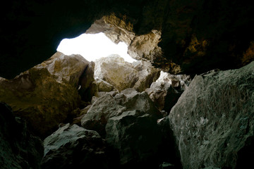 Fototapeta na wymiar Stone cave inside near entrance