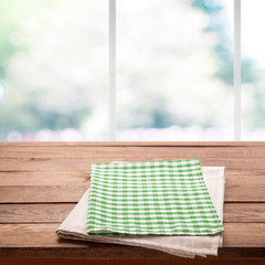 Tablecloth on wooden table on kitchen. Canvas, dish towels on kitchen top view mock up. Selective...