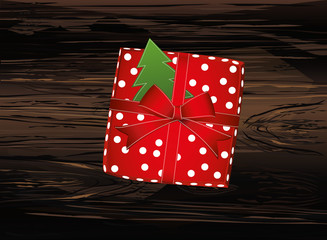 Christmas gift box with green tree. View from above. Vector on wooden background. Greeting card or invitation for a holiday.
