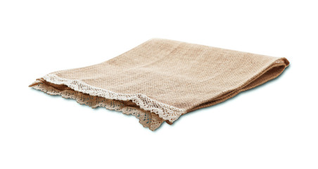 Fototapeta na wymiar Empty canvas napkin with lace, tablecloth isolated on white background. Can used for display or montage your products. Selective fokus