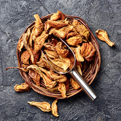 Dried pear, apple on black table. Top view.