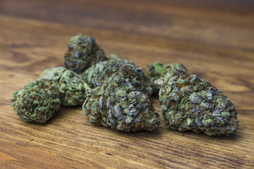 Forbidden Fruit strain buds on wood