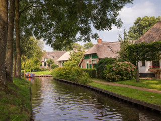 Fototapeta na wymiar Canal view in the dutch village Giethoorn - also known as the Venice of the Netherlands