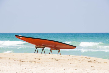 SUP  against the blue sea and white sand