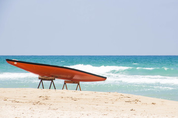 SUP  against the blue sea and white sand