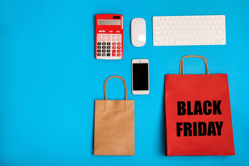 Stylish flat lay composition with shopping bags on color background
