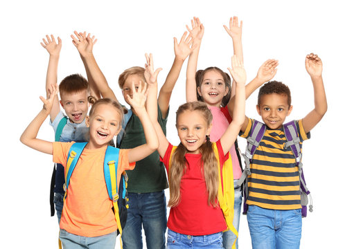 Group of little school children with backpacks on white background