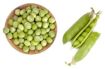 Green peas in a Cup isolated on white, top view