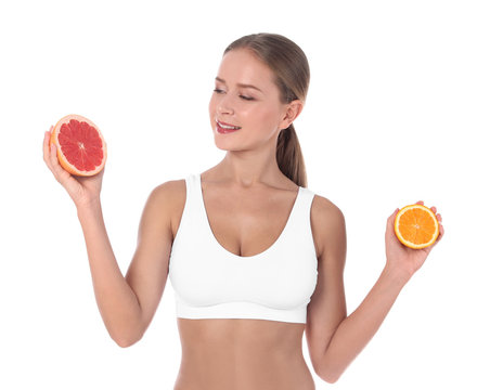 Slim woman with grapefruit and orange on white background. Healthy diet