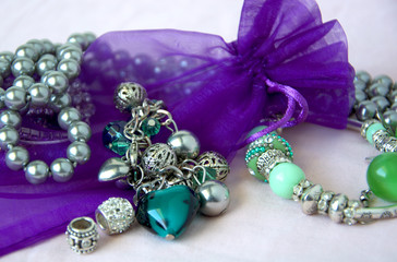 Women's jewelry beads, pearl with ring in delicate Violette colors, tones.