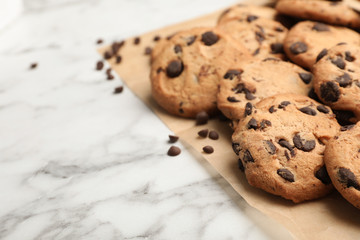 Tasty chocolate cookies on marble table, closeup