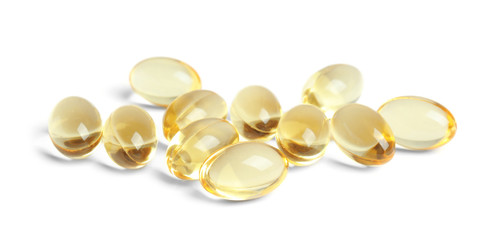 Cod liver oil pills on white background