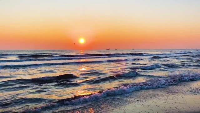 sunset over sea and beach in Rimini, Italy