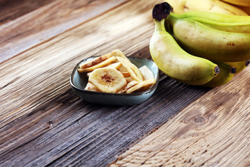 Banana chips, dehydrated slices of fresh ripe bananas.