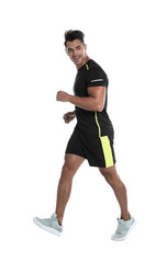 Sporty young man running on white background