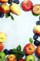 Various fresh fruits. Thanksgiving apples, and pears on rustic background.
